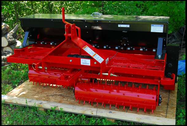 McCormick by Woods Turf Renovator - this is a combination device that roughs up the soil surface, drops seed, and then packs the soil with the rear roller. 
