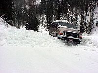 Ford F-250 navigating a snow slide